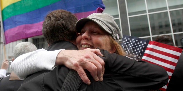 Aug. 4, 2010: Sheree Red Bornand, right, hugs Aidan Dunn after hearing the decision in the United States District Court proceedings challenging Proposition 8 outside of the Phillip Burton Federal Building in San Francisco.