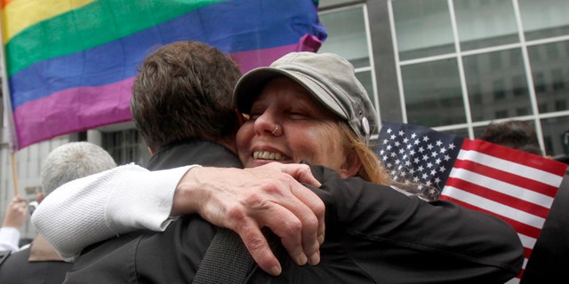 Aug. 4, 2010: Sheree Red Bornand, right, hugs Aidan Dunn after hearing the decision in the United States District Court proceedings challenging Proposition 8 outside of the Phillip Burton Federal Building in San Francisco.