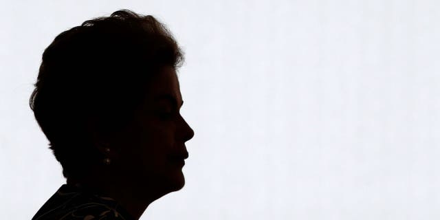 Brazil's President Dilma Rousseff arrives for a ceremony to announce an addition to the government subsidized housing program coined "My home, My life, at Planalto presidential palace in Brasilia, Brazil, Friday, May 6, 2016. Brazil's Senate impeachment commission has started deliberations over whether to recommend Rousseff's suspension to the full house. A Friday vote by a simple majority will send the case to all senators for a final decision Wednesday. (AP Photo/Eraldo Peres)