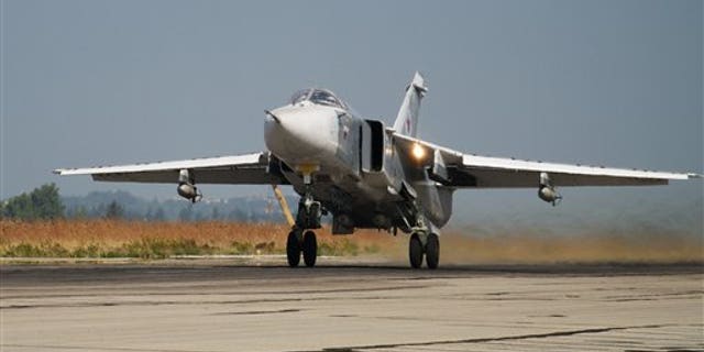 A Russian war plane takes off on a combat mission Thursday. (AP Photo/Vladimir Isachenkov)