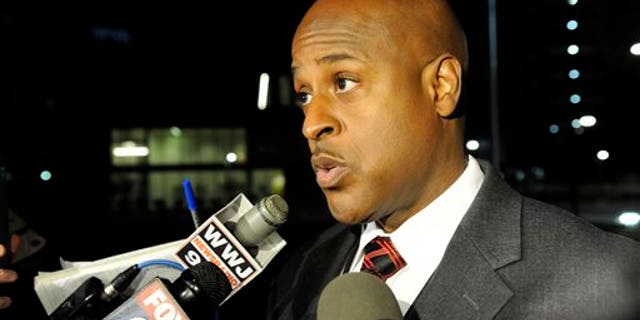 Eric Jones, Detroit interim executive fire commissioner, tells reporters two emergency medical technicians responded to a 911 call and were treating the woman for an injured ankle when the man attacked one of the EMTs. Jones says the other EMT tried to intervene and was attacked. (David Coates/The Detroit News via AP)