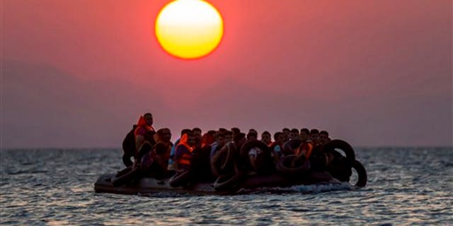 Migrants on a dinghy heading from Turkey to Greece in 2015.