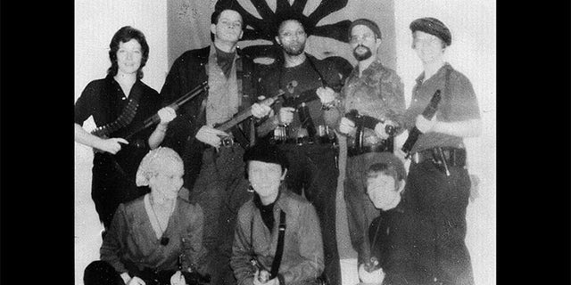 Symbionese Liberation Army members: Patty Hearst (lower left), Cinque (center rear), Camilla Hall (right rear), William Wolfe (second from left rear) and William Harris (second from right rear).