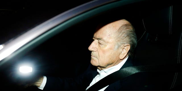 FILE - In this Sept. 29, 2015 file photo FIFA President Sepp Blatter drives his car into the garage of the FIFA headquarters on his way to work in Zurich, Switzerland (AP Photo/Michael Probst, file)