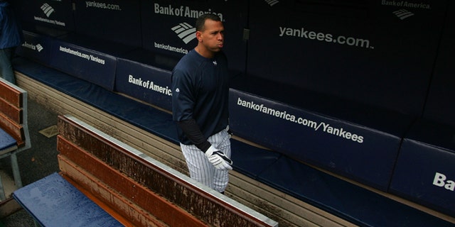 NEW YORK - OCTOBER 15: Alex Rodriguez #13 of the New York Yankees walks through the dugout during workouts on October 15, 2009 at Yankee Stadium in the Bronx borough of New York City. (Photo by Jared Wickerham/Getty Images)