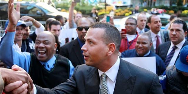 FILE - In this Oct. 1, 2013, file photo, New York Yankees' Alex Rodriguez arrives at the offices of Major League Baseball in New York. Rodriguez's 211-game suspension was the longest of the 13 announced in August for players connected to a Florida anti-aging clinic accused of distributing banned PEDs. The Yankees' slugger was the only one to contest the penalty, and the year ends with an arbitrator yet to rule. (AP Photo/David Karp, File)