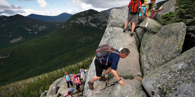 Aug. 7, 2015: Day-hikers scramble over rocky boulders on the Appalachian Trail below the summit of Mt. Katahdin in Baxter State Park in Maine. The sharp rise in the number people using the Appalachian Trail is causing headaches for officials, who say theyre dealing with increasing problems along the 2,189-mile footpath.