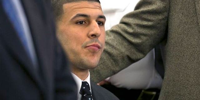 FILE - In this April 15, 2015, file photo, former New England Patriots football player Aaron Hernandez listens as the guilty verdict is read during his murder trial at the Bristol County Superior Court in Fall River, Mass. The Bristol District Attorney's Office said Friday, July 24, 2015, that the investigation and trial cost them nearly a half-million dollars in overtime and expenses. Hernandez was found guilty of first-degree murder in the shooting death of Odin Lloyd in June 2013, and faces a mandatory sentence of life in prison without parole. (Dominick Reuter/Pool Photo via AP, File)