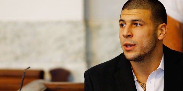 NORTH ATTLEBORO, MA - AUGUST 22: Aaron Hernandez sits in the courtroom of the Attleboro District Court during his hearing on August 22, 2013 in North Attleboro, Massachusetts. Former New England Patriot Aaron Hernandez has been indicted on a first-degree murder charge for the death of Odin Lloyd. (Photo by Jared Wickerham/Getty Images)