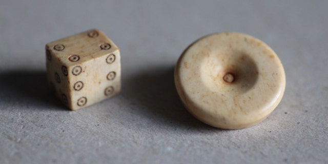 Dice design has changed very little since Roman times. Researchers found a gaming piece and die during excavations of the Roman settlement.