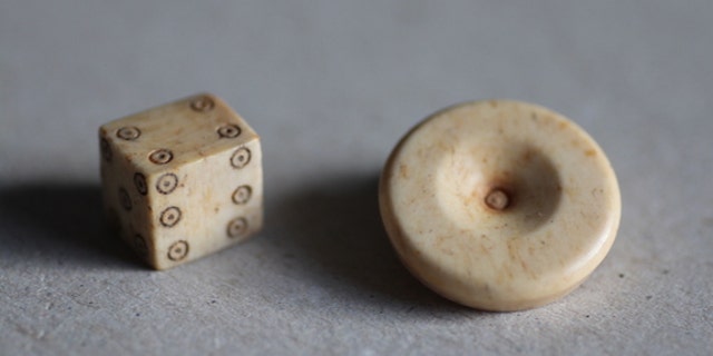 Dice design has changed very little since Roman times. Researchers found a gaming piece and die during excavations of the Roman settlement.