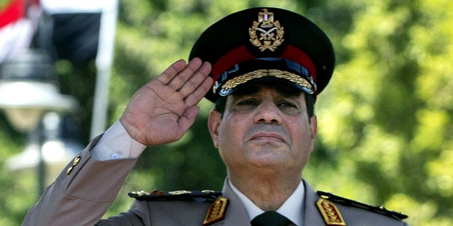 April 24, 2013 - FILE photo of Egyptian Defense Minister Gen. Abdel-Fattah el-Sissi during an arrival ceremony for U.S. Secretary of Defense Chuck Hagel at the Ministry of Defense in Cairo.