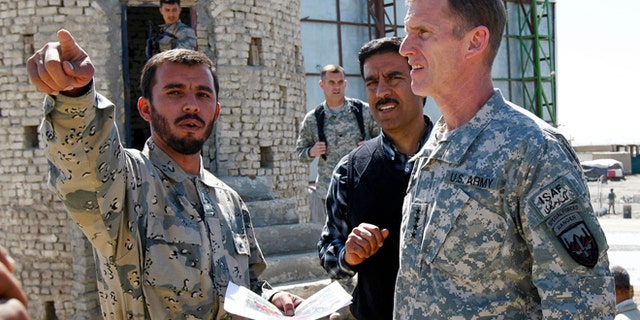 Warlord and Afghan border police Commander Colonel Abdul Razziq, seen here with General Stanley McChrystal in 2010, is believed to earn a major cut from all trucking that passes through the Spin Boldak region.