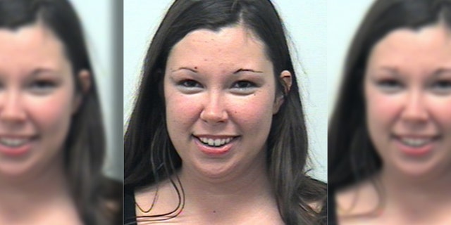 Adriane Moss allegedly locked herself and her son in a hot car for more than an hour, police said.