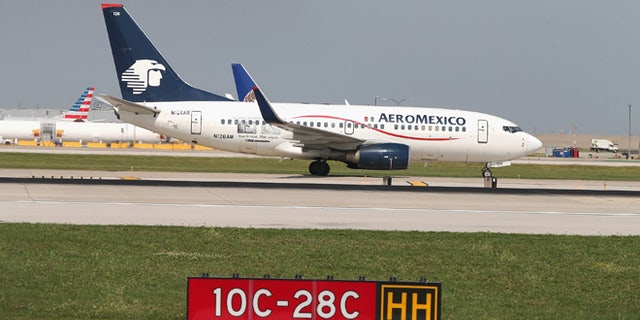 CHICAGO, IL - SEPTEMBER 19: An AeroMexico jet taxis at O'Hare International Airport on September 19, 2014 in Chicago, Illinois. In 2013, 67 million passengers passed through O'Hare, another 20 million passed through Chicago's Midway Airport, and the two airports combined moved more than 1.4 million tons of air cargo. (Photo by Scott Olson/Getty Images)