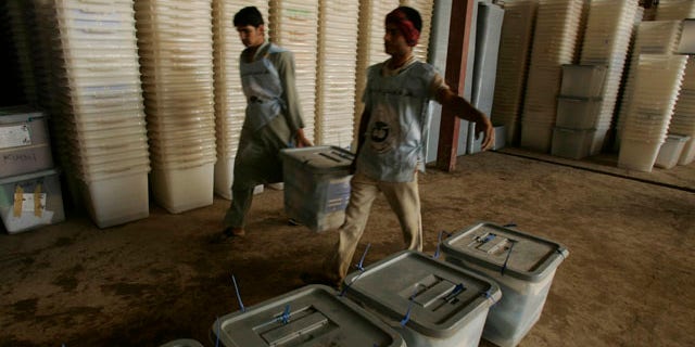 Sept. 19: Afghan election workers stack ballot boxes at Afghanistan's Independent Election Commission in Herat. More than 1 million ballots may be thrown out due to suspicions of fraud.