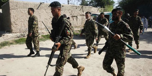 April 15, 2012: Afghan National Army soldiers arrive at the Provincial Reconstruction Team (PRT) after gunmen launched a coordinated attack in Jalalabad province.