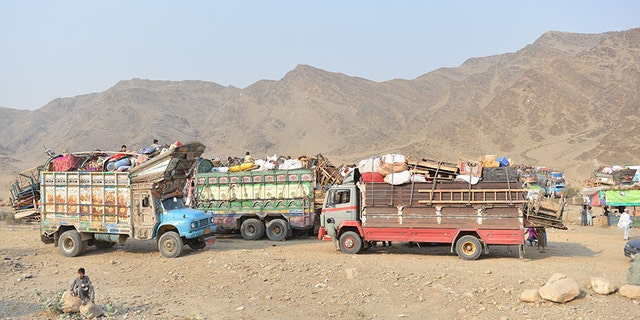 Trucks carrying the belongings of returnees from Pakistan line up at the returnee center, near the Afghan-Pakistan border.
