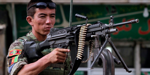 July 4: An Afghan soldier earlier searched for the missing British soldier before he was found dead.