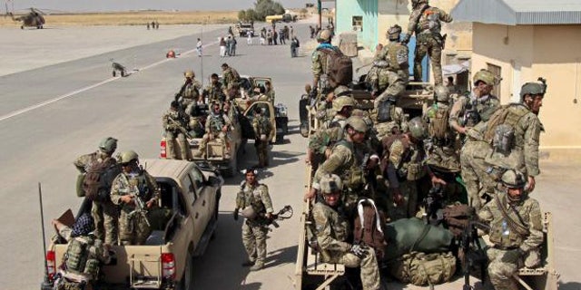 Sept. 29, 2015: Afghan special forces arrive for a battle with the Taliban in Kunduz. (Reuters)