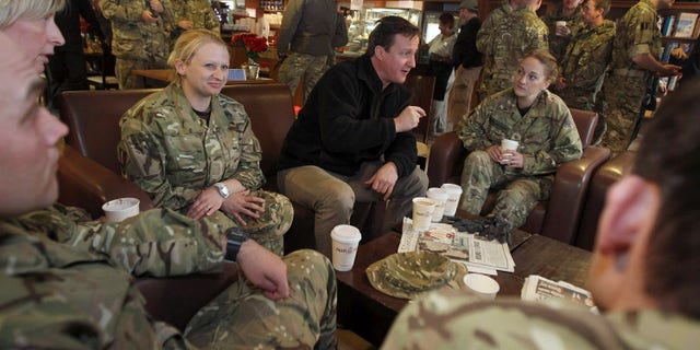 December 20: British Prime Minister David Cameron, center, meets with British soldiers at Kandahar airfield, Afghanistan.