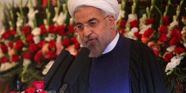 Iranian President Hasan Rouhani speaks during a ceremony celebrating the Persian New Year, Nowruz at the presidential palace in Kabul, Afghanistan, Thursday, March 27, 2014. In his first visit to Afghanistan as Iran's president, Rouhani has called for regional unity while at the same time saying international forces brought "destruction" to Afghanistan. (AP Photo/Massoud Hossaini)