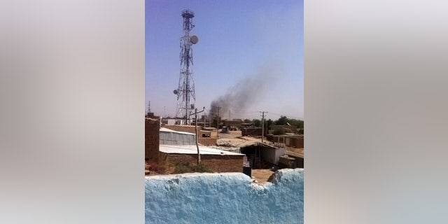 Sept. 28, 2015: Smoke rises from a police station during clashes between Taliban fighters and Afghan security forces, in Kunduz city, north of Kabul. (AP Photo)
