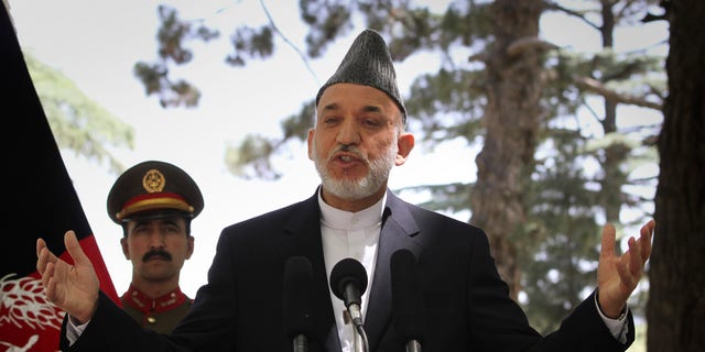 May 31: Afghan President Hamid Karzai gestures during a press conference at the presidential palace in Kabul, Afghanistan. Angered by civilian casualties, Karzai said Tuesday he will no longer allow NATO airstrikes on houses, issuing his strongest statement yet against strikes that the military alliance says are key to its war on Taliban insurgents. (AP)