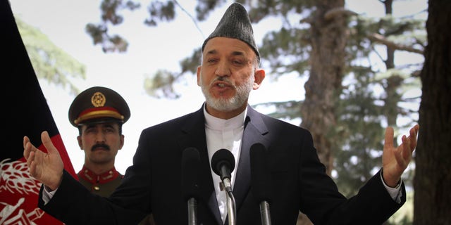 May 31: Afghan President Hamid Karzai gestures during a press conference at the presidential palace in Kabul, Afghanistan. Angered by civilian casualties, Karzai said Tuesday he will no longer allow NATO airstrikes on houses, issuing his strongest statement yet against strikes that the military alliance says are key to its war on Taliban insurgents. (AP)