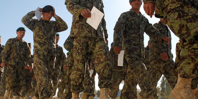Jan. 6: Afghan National Army soldiers hold their graduation certificates after graduating from a senior-enlisted professional development course in Kandahar, Afghanistan. Officials said Jan. 6 Defense Secretary Robert Gates has decided to send an additional 1,400 Marine combat forces to Afghanistan.
