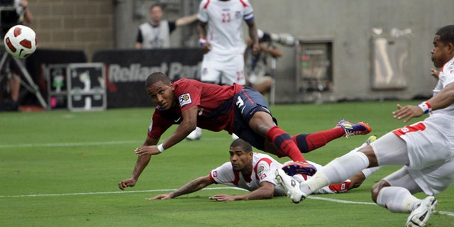 HOUSTON - JUNE 22: Juan Agudelo #9 of the U.S.A. puts a header on goal in the first half as Roman Torres #5 of Panama is late defending on the play in the first half at Reliant Stadium on June 22, 2011 in Houston, Texas. (Photo by Bob Levey/Getty Images)