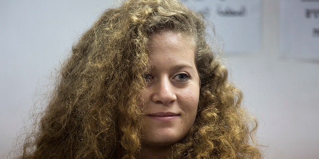 Palestinian protest icon Ahed Tamimi is in a courtroom at the Ofer military prison near Jerusalem, Tuesday, Feb. 13, 2018. The Israeli military judge overseeing the trial of Palestinian teenager Tamimi has ordered all proceedings to take place behind closed doors.