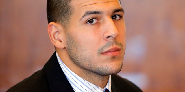 FILE 2013: Former New England Patriots NFL football player Aaron Hernandez attends a pretrial court hearing in Fall River, Mass. Hernandez is set to be arraigned on murder charges for allegedly ambushing and gunning down two men in 2012 after a chance encounter inside a Boston nightclub.