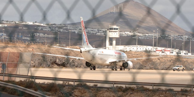 LANZAROTE, SPAIN - OCTOBER: An Air Europa Boeing-737 sits parked at the end of the runway on October 31, 2008 at Lanzarote airport in the Canary Islands, Spain. The flight chartered by Thomas Cook arriving from Glasgow at 7.10 this morning experienced problems with it's undercarriage and skidded off the runway as it came in to land. No one was hurt and it is thought weather was to blame for destabilising it's landing (Photo by Torsten Laursen/Getty Images)