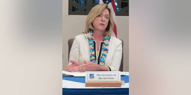 Air Force Secretary Deborah Lee James speaks to reporters at Joint Base Pearl Harbor-Hickam in Hawaii on Monday, Nov. 17, 2014. James said she hopes to make all jobs in the service open to qualified women in the next year and a half. (AP Photo/Audrey McAvoy)