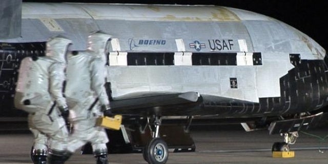An Air Force X-37B robotic space plane is shown after it landed at Vandenberg Air Force Base in California. The fourth mission of the program is now underway and just passed 600 days in Earth orbit.