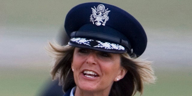 Aug. 4, 2008: In this file photo, Brig. Gen. Margaret Woodward, the 389th Airlift Wing Commander, waves on the tarmac of Andrews Air Force Base in Maryland.