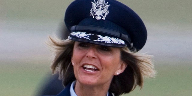 Aug. 4, 2008: In this file photo, Brig. Gen. Margaret Woodward, the 389th Airlift Wing Commander, waves on the tarmac of Andrews Air Force Base in Maryland.