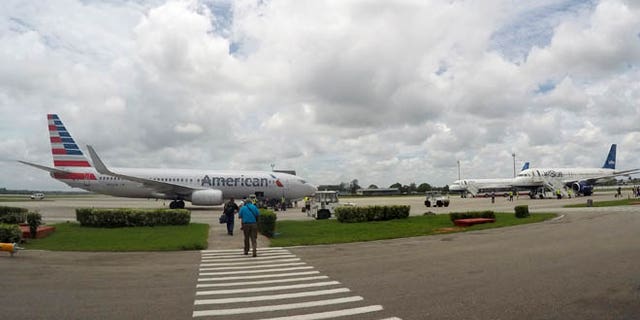 In this Friday, June 10, 2016, photo, American Airlines and JetBlue Airways charter flights wait to depart from Havanaââ¬â¢s Jose Marti International Airport. The Department of Transportation said Friday that six airlines: American, Frontier, JetBlue, Silver Airways, Southwest and Sun Country, have been selected for routes to nine Cuban cities other than Havana. (AP Photo/Scott Mayerowitz)