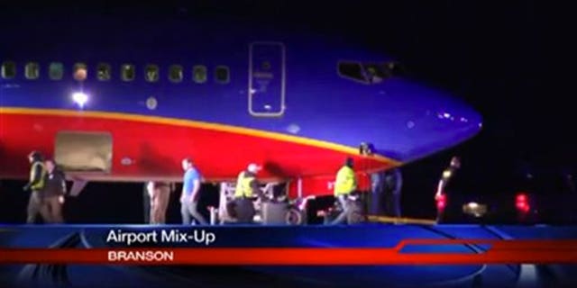 This frame grab provided by KSPR-TV shows a Southwest Airlines flight that was scheduled to arrive Sunday Jan. 12, 2014, at Branson Airport in southwest Missouri instead landed at an airport 7 miles north with a runway about half the size of the intended destination. (AP Photo/KSPR-TV)