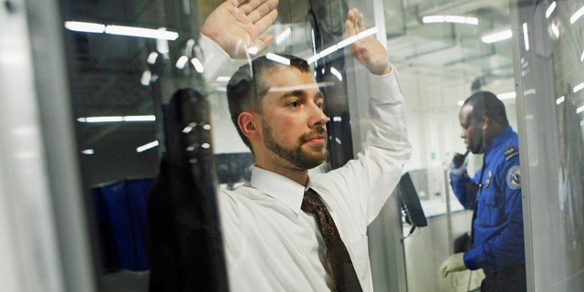 FILE - In this Dec. 30, 2009 file photo, Tanner Suttles, left, a Transportation Security Administration employee is screened by a TSA officer during a demonstration of passenger screening technology at the TSA Systems Integration Facility in Arlington, Va. Security experts have floated several new ideas to enhance airport security in the weeks since authorities say a Nigerian man on a Detroit-bound jetliner tried to ignite explosives hidden in his crotch. Some ideas are being tested, others are far from proven, some aren't being seriously considered. Many raise questions about civil liberties and all are costly. (AP Photo/Haraz N. Ghanbari)