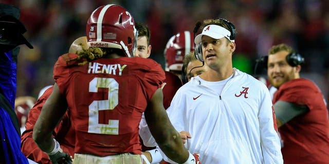Nov 7, 2015; Tuscaloosa, AL, USA; Alabama Crimson Tide running back Derrick Henry (2) celebrates a touchdown with offensive coordinator Lane Kiffin during the third quarter against the LSU Tigers at Bryant-Denny Stadium. Mandatory Credit: Marvin Gentry-USA TODAY Sports