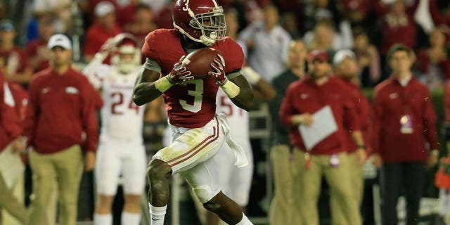 Oct 10, 2015; Tuscaloosa, AL, USA; Alabama Crimson Tide wide receiver Calvin Ridley (3) catches a touchdown pass against the Arkansas Razorbacks at Bryant-Denny Stadium. Mandatory Credit: Marvin Gentry-USA TODAY Sports