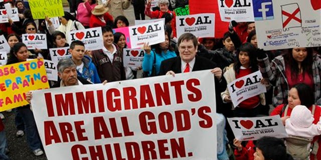 Opponents of Alabama's immigration law gather for a rally in front of the Statehouse in Montgomery, Alabama.