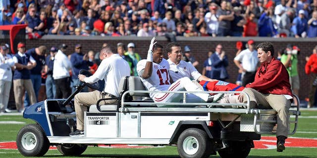 Alabama running back Kenyan Drake (17) waves while being taken off the field after an injury inring the first half of an NCAA college football game against Mississippi in Oxford, Miss., Saturday, Oct. 4, 2014. (AP Photo/The Daily Mississippian, Thomas Graning)