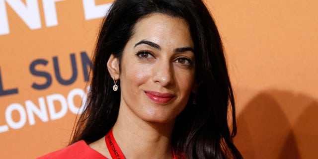 Human rights attorney Amal Alamuddin, George Clooney's fiancée, turned down a seat on a UN committee investigating human rights violations, paving the way for a controversial ex-judge to take the spot. (AP)
