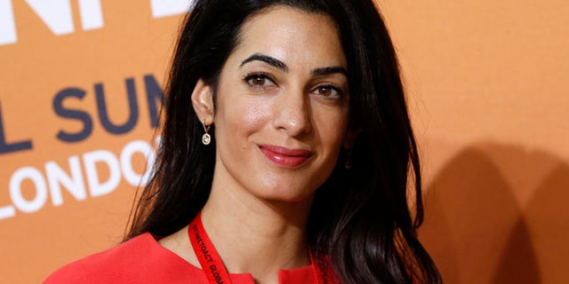 Human rights attorney Amal Alamuddin, George Clooney's fiancée, turned down a seat on a UN committee investigating human rights violations, paving the way for a controversial ex-judge to take the spot. (AP)