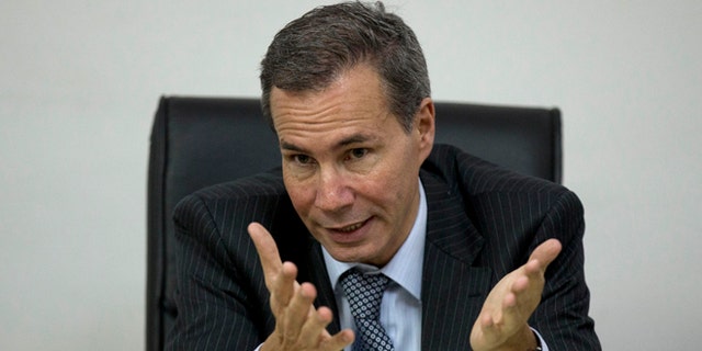 FILE - In this May 29, 2013, file photo, Alberto Nisman, the prosecutor investigating the 1994 bombing of the Argentine-Israeli Mutual Association community center, talks to journalists in Buenos Aires, Argentina. Nisman who accused the government of secret deals with Iran over the investigation was found shot dead at his apartment early Monday Jan. 19, 2014. He was due to participate in a closed-door session with Congress over his claim last week that Argentine President Cristina Fernandez and Foreign Minister Hector Timerman covered up a deal with Iran. (AP Photo/Natacha Pisarenko, File)