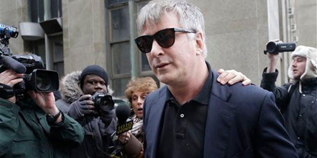 In this Tuesday, Nov. 12, 2013 file photo, actor Alec Baldwin leaves criminal court in New York.