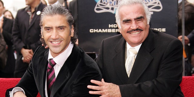 LOS ANGELES - DECEMBER 02: Ranchera singer Vicente Fernandez (R) poses with his son Alejandro Fernandez, who is honored with a Star On The Walk Of Fame, on December 2, 2005 in Los Angeles, Califoria. (Photo by Frazer Harrison/Getty Images)